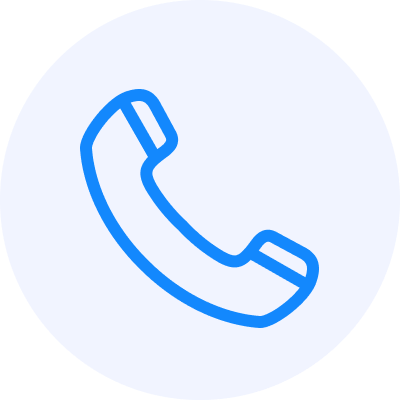 Blue outline of a classic telephone handset icon on a light gray background.